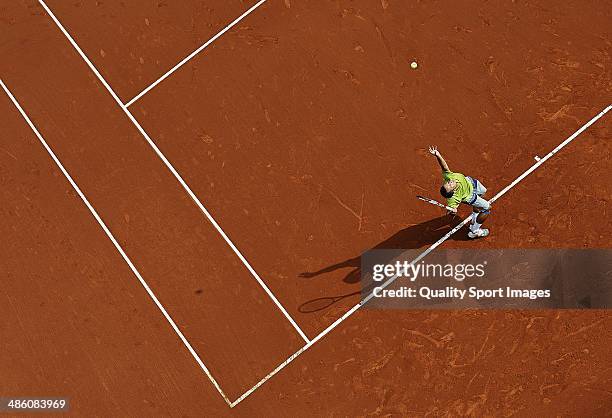 Philipp Kohlschreiber of Germany serves against Edouard Roger-Vasselin of France during day two of the ATP Barcelona Open Banc Sabadell at the Real...
