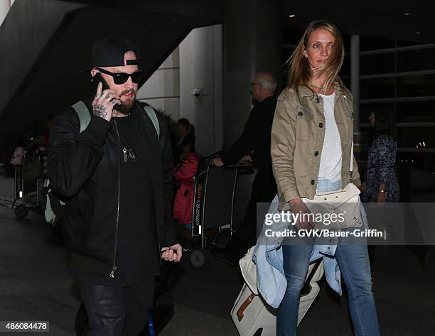 Cameron Diaz and Benji Madden are seen at LAX. On August 31, 2015 in Los Angeles, California.