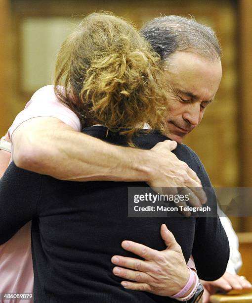 Lauren Teresa Giddings' boyfriend David Vandiver embraces Karen Giddings in the courtroom before Stephen McDaniel plead guilty in court Monday...