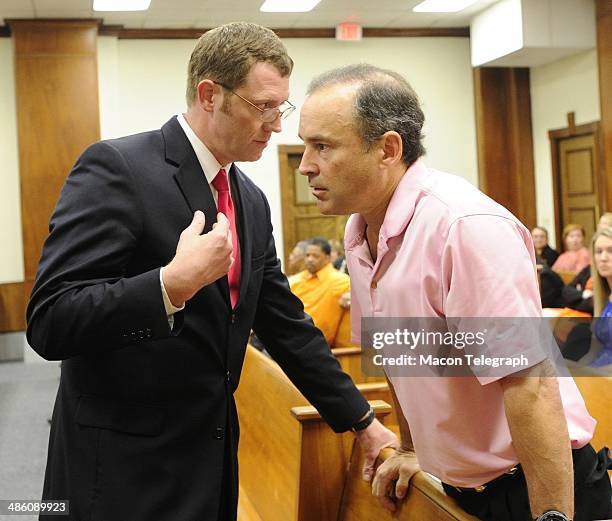 Lauren Teresa Giddings' boyfriend David Vandiver talks with District Attorney David Cooke in the courtroom before Stephen McDaniel plead guilty in...