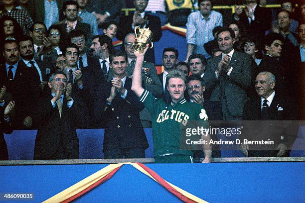 Larry Bird of the Boston Celtics is presented the MVP award against Real Madrid during the 1988 McDonald's Championships on October 24, 1988 at the...