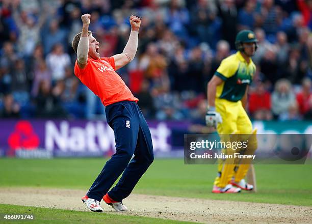 David Willey of England celebrates taking the wicket of Steve Smith of Australia during the NatWest T20 International match between England and...