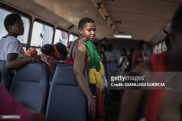 Young unmarried Swazi women prepare in a bus for the last day of the annual royal reed dance at the Ludzidzini Royal palace on August 31, 2015 in...