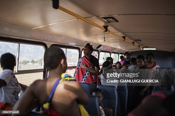 Maidens get ready in a bus on the last day of the annual royal Reed Dance at the Ludzidzini Royal palace on August 31, 2015 in Lobamba, Swaziland....