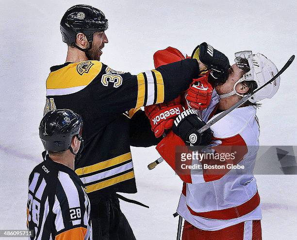 At the end of the first period, Detroit's Brendan Smith got a smile out of Bruins captain Zdeno Chara, as he challenged the big defenseman near the...