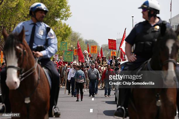 Members of the Cowboy and Indian Alliance, including Native Americans, farmers and ranchers from across the United States, are escorted by police as...