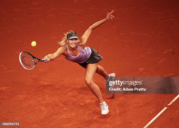 Maria Sharapova of Russia hits a forehand during her first round match against Lucie Safarova of the Czech Republic during day 2 of the Porsche...