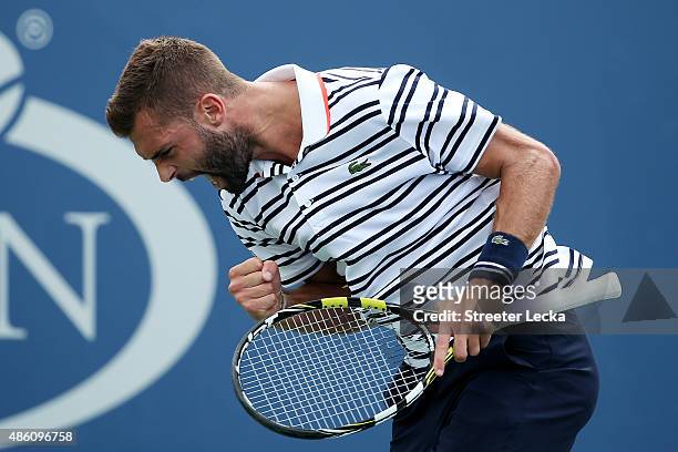Benoit Paire of France reacts against Kei Nishikori of Japan during their Men's Single First Round match on Day One of the 2015 US Open at the USTA...