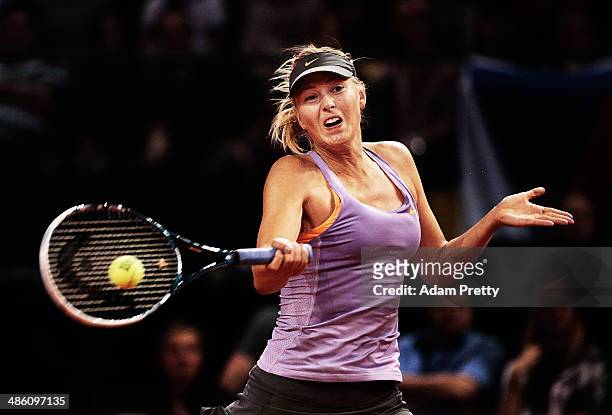 Maria Sharapova of Russia hits a forehand during her first round match against Lucie Safarova of the Czech Republic during day 2 of the Porsche...