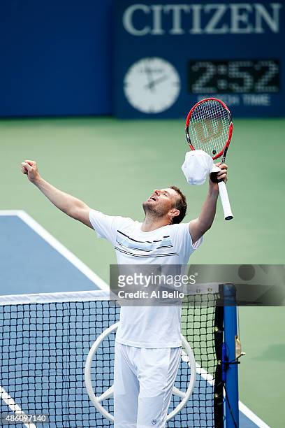 Mardy Fish of the United States reacts after defeating Marco Cecchinato of Italy during his Men's Singles First Round match on Day One of the 2015 US...