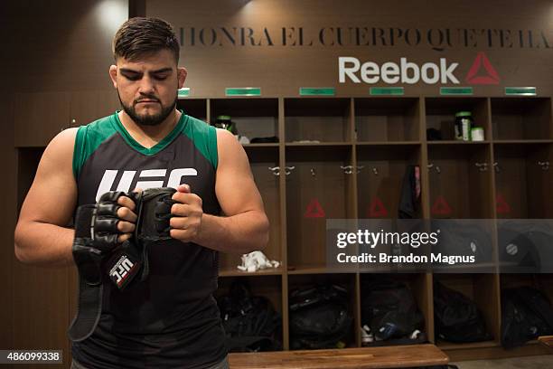 Head coach Kelvin Gastelum prepares the gloves for Cesar Arzamendia before facing Oliver Meza during the filming of The Ultimate Fighter Latin...