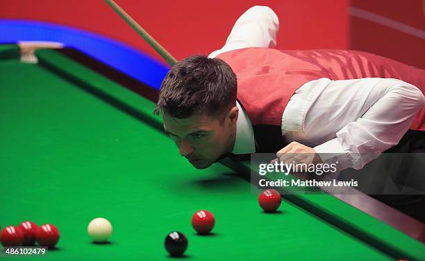 Michael Holt of England in action against Mark Allen of Northern Ireland during day four of the The Dafabet World Snooker Championship at Crucible...