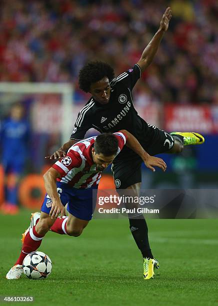 Willian of Chelsea battles for the ball with Diego of Atletcio Madrid during the UEFA Champions League Semi Final first leg match between Club...