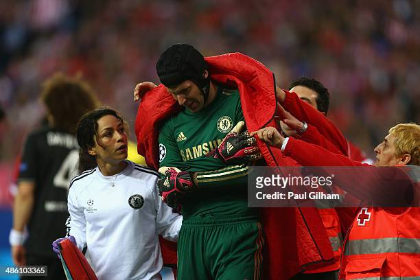 Petr Cech walks off the pitch after being injured during the UEFA Champions League Semi Final first leg match between Club Atletico de Madrid and...