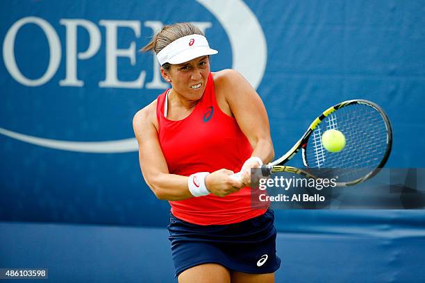 Irina Falconi of the United States returns a shot against Samantha Crawford of the United States during her Women's Singles First Round match on Day...