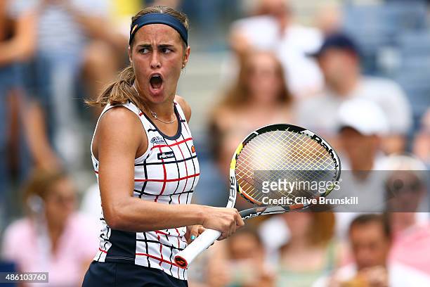 Monica Puig of Puerto Rico reacts against Venus Williams of the United States during her Women's Singles First Round match on Day One of the 2015 US...