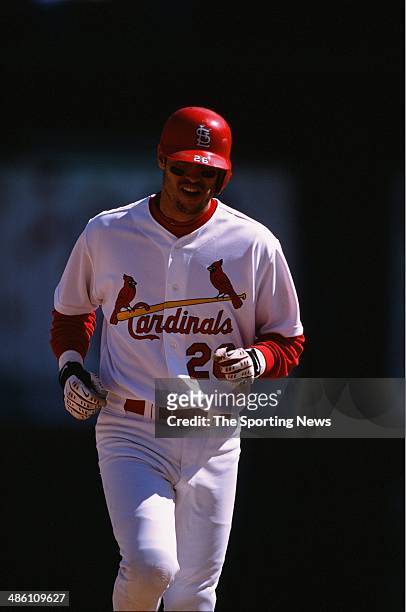 Eli Marrero of the St. Louis Cardinals runs against the Cincinnati Reds at Busch Stadium on May 19, 2002 in St. Louis, Missouri. The Cardinals...