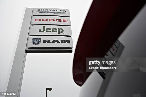 Chrysler, Dodge, Jeep and RAM signage stand outside the Key Auto Mall car dealership in Moline, Illinois, U.S., on Friday, Aug. 28, 2015. Domestic...