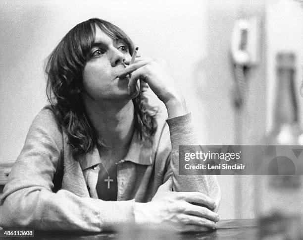 Iggy Pop smoking a cigarette at the MC5 house in 1968 at 1510 Hill Street in Ann Arbor, Michigan.