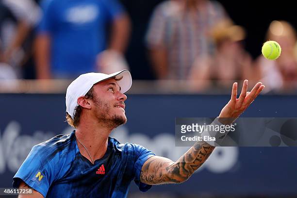 Andreas Haider-Maurer of Austria serves against Vasek Pospisil of Canada during their Men's Singles First Round match on Day One of the 2015 US Open...