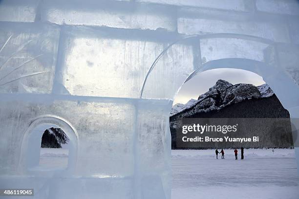 an ice sculpture on frozen lake louise - igloo stock pictures, royalty-free photos & images