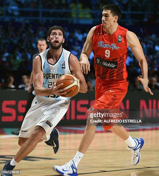 Argentina's basketball small forward Patricio Garino is marked by Puerto Rico's centre Bryan Diaz during a 2015 FIBA Americas Championship Men's...