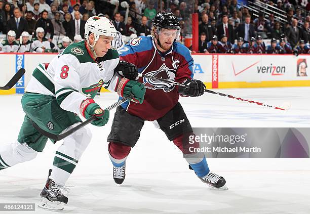 Gabriel Landeskog the Colorado Avalanche skates against Cody McCormick of the Minnesota Wild in Game Two of the First Round of the 2014 Stanley Cup...