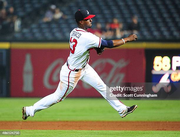 Pedro Ciriaco of the Atlanta Braves throws out a runner during the ninth inning against the Miami Marlins at Turner Field on August 31, 2015 in...