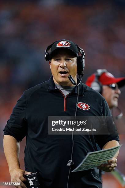 Defensive Coordinator Eric Mangini of the San Francisco 49ers stands on the sideline during the game against the Denver Broncos at Sports Authority...