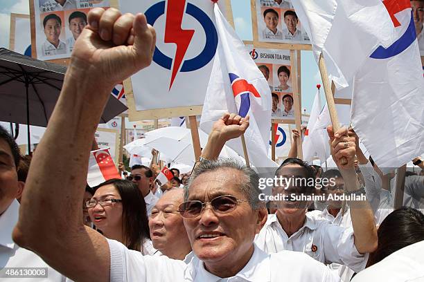 People's Action Party supporters react to their candidate speech after nomination is closed at Raffles Institution on September 1, 2015 in Singapore....