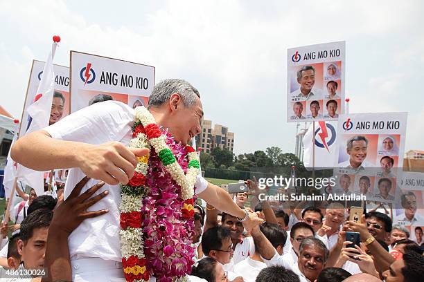 Prime Minister and People's Action Party Secretary General, Lee Hsien Loong reacts with party supporters after nomination is closed at Raffles...