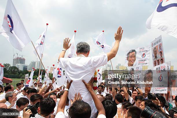 Prime Minister and People's Action Party Secretary General, Lee Hsien Loong reacts with party supporters after nomination is closed at Raffles...