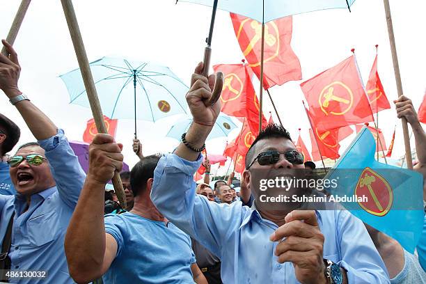 Worker's Party supporters react to their candidate speech after nomination is closed at Raffles Institution on September 1, 2015 in Singapore....