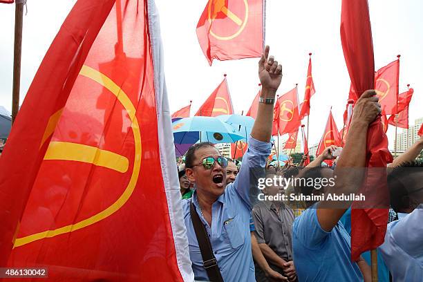 Worker's Party supporters react to their candidate speech after nomination is closed at Raffles Institution on September 1, 2015 in Singapore....