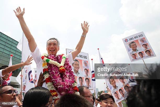 Prime Minister and People's Action Party Secretary General, Lee Hsien Loong reacts with party supporters after nomination is closed at Raffles...