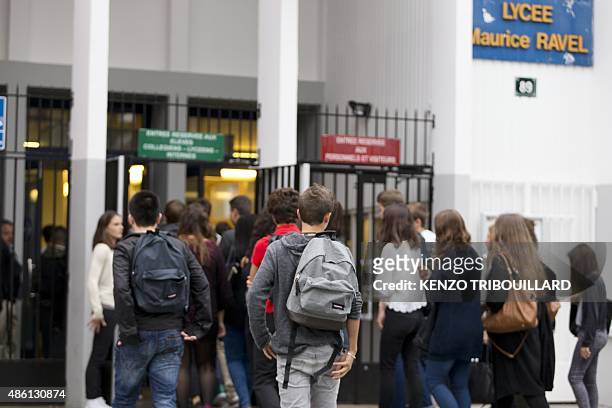 Students arrive at the Maurice Ravel high school in Paris, on September 1 for the start of the new school year. AFP PHOTO / KENZO TRIBOUILLARD