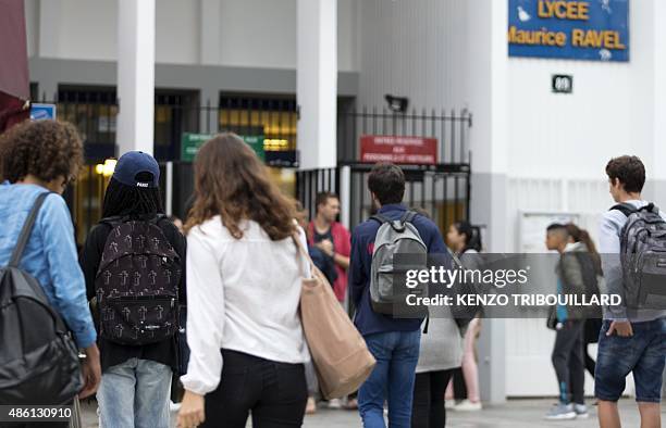 Students arrive at the Maurice Ravel high school in Paris, on September 1 for the start of the new school year. AFP PHOTO / KENZO TRIBOUILLARD