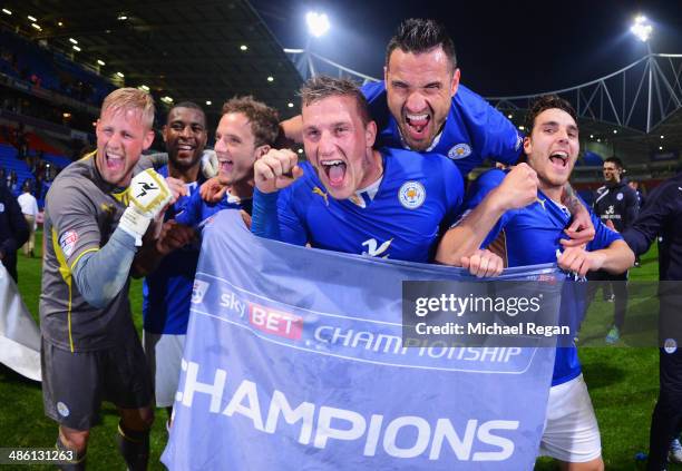 Marcin Wasilewski , Chris Wood and Matty James of Leicester City celebrate winning the Championship with goalkeeper Kasper Schmeichel after the Sky...
