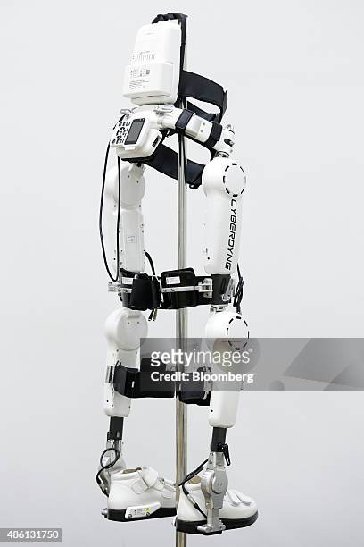 Cyberdyne Inc.'s lower-limb model Hybrid Assistive Limb exoskeleton robot suit for medical use sits on display for a photograph at the company's...