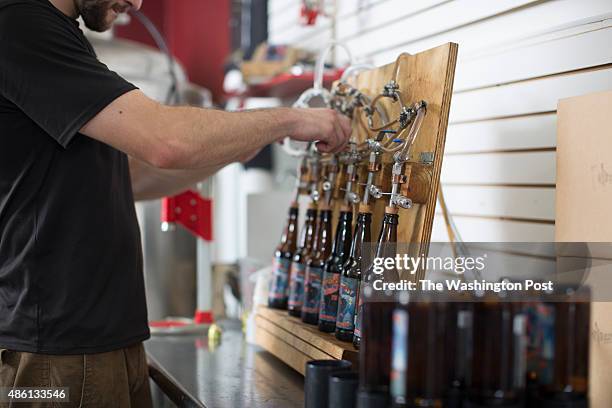 Stephen Norberg, founder of Thunder Beast Root beer, brews , bottles and hand labels his root beer in Northeast DC.