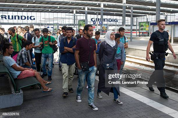 Police detain migrants arriving at Munich Hauptbahnhof main railway station without passports or valid visas on September 1, 2015 in Munich, Germany....