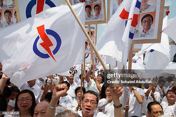 People's Action Party supporters react to their candidate speech after nomination is closed at Raffles Institution on September 1, 2015 in Singapore....