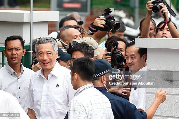 Prime Minister and People's Action Party Secretary General, Lee Hsien Loong arrives at the nomination centre with party candidates of the Ang Mo Kio...