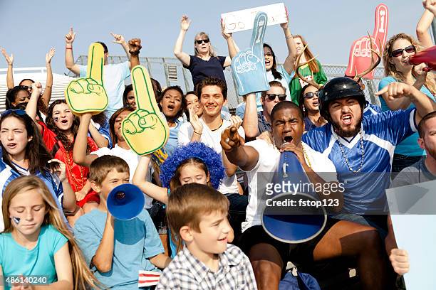 football fans cheer for their team during sports event. stadium. - voetbalcompetitie sportevenement stockfoto's en -beelden