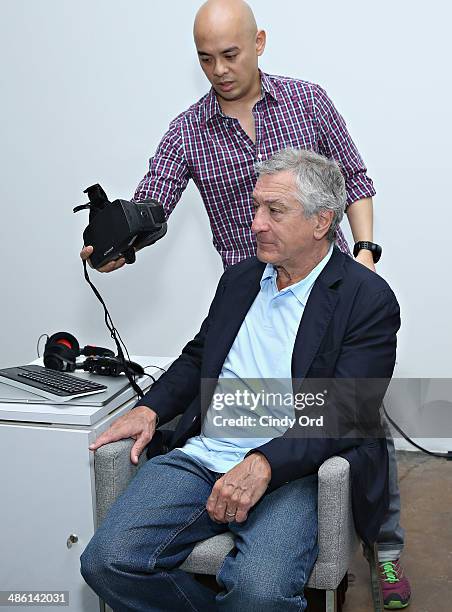 Tribeca Film Festival co-founder Robert De Niro uses virtual reality goggles as part of 'The Oculus Rift Experience' at the Storyscapes Press Preview...