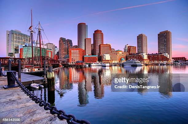 boston skyline along the harborwalk - boston massachusetts stock pictures, royalty-free photos & images