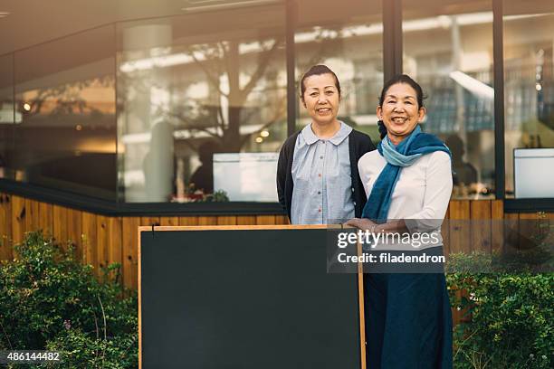 in front of the bar-restaurant - temptation stock pictures, royalty-free photos & images