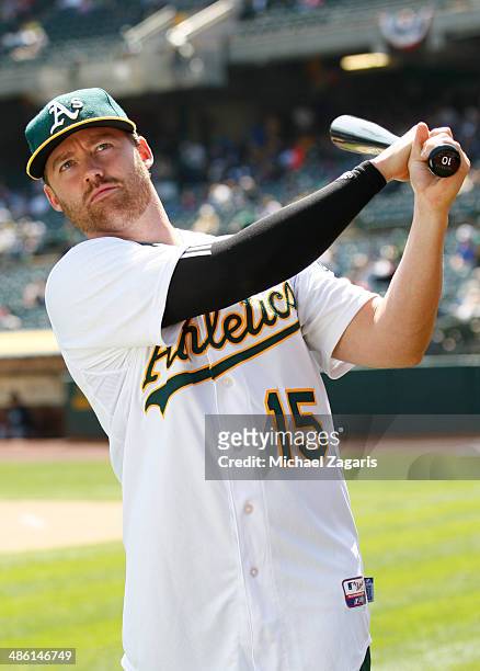 Jake Elmore of the Oakland Athletics stands on the field prior to the game against the Seattle Mariners at O.co Coliseum on April 6, 2014 in Oakland,...