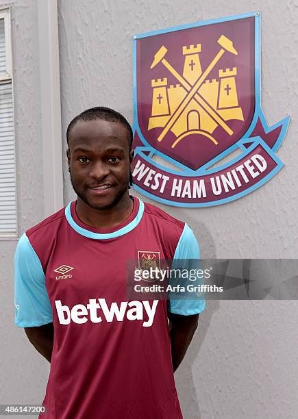 Victor Moses poses after signing for West Ham United on a season-long loan at West Ham United's training ground, Chadwell Heath Romford on September...
