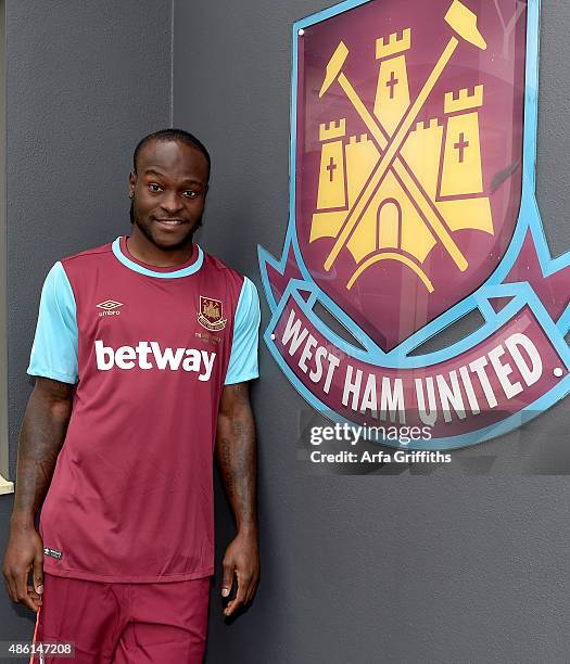 Victor Moses poses after signing for West Ham United on a season-long loan at West Ham United's training ground, Chadwell Heath Romford on September...